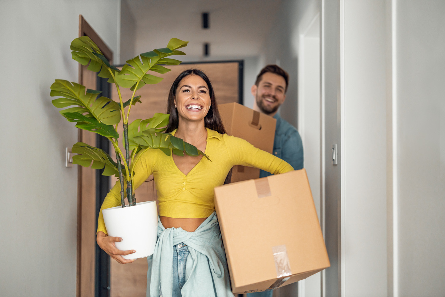 Happy couple moving into a new home