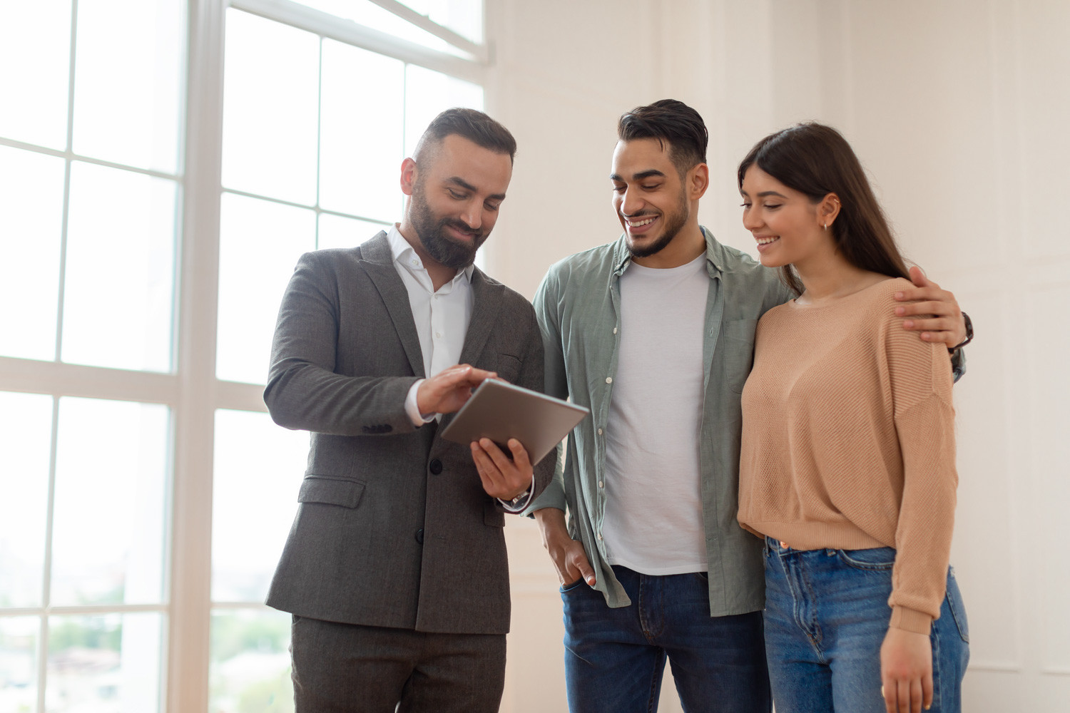 real estate agent helping people buying a home