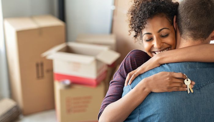 New House Owners Hugging In Their New Home - Forge Home Consulting