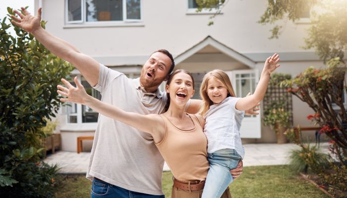 Happy Family with New House - Forge Home Consulting